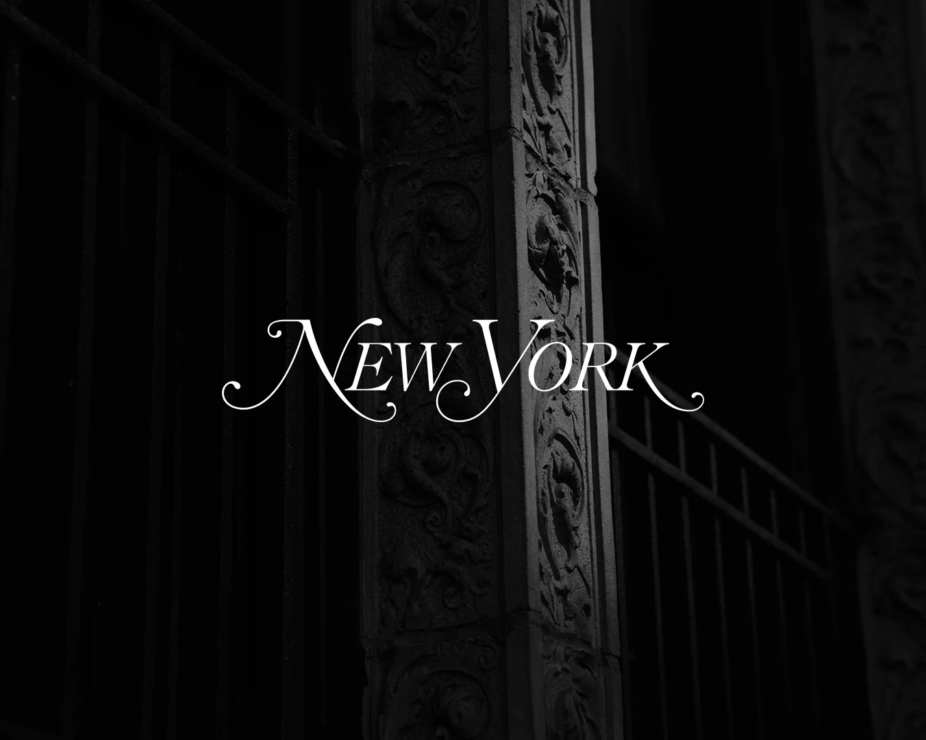 New York Magazine logo in elegant white typography against dark urban background with fire escape