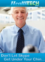 Professional businessman in blue shirt and tie smiling at camera in healthcare office setting
