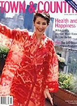 Woman in red traditional Asian dress on Town & Country magazine cover featuring health and wellness content
