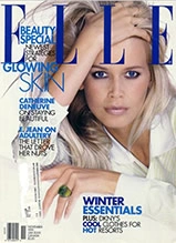 ELLE magazine cover featuring Carmen Electra with platinum blonde hair and winter essentials styling guide