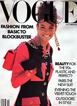 Vogue magazine cover featuring model in red jacket and black outfit with fashion and beauty headlines
