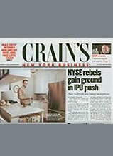 Crain's New York Business newspaper front page showing business headlines and NYSE trading floor photo