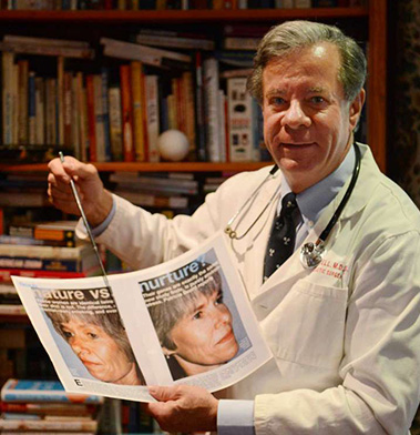 Doctor in white coat holding newspaper in library office with bookshelves
