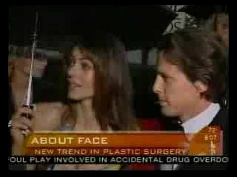 News broadcast showing two people discussing cosmetic surgery with chyron about foul play in accidental drug overdose